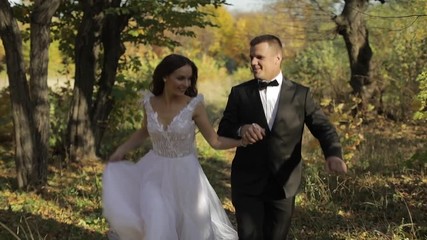 Wedding couple. Lovely groom and bride.  Happy family. Man and woman in love. Wedding day. Slow motion	