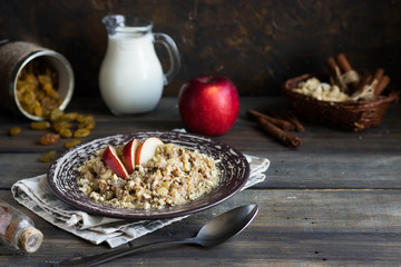 Buckwheat porridge with milk, apple, raisins and cashew nuts