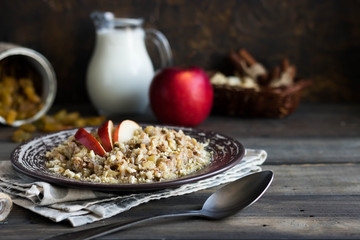 Buckwheat porridge with milk, apple, raisins and cashew nuts