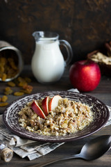 Buckwheat porridge with milk, apple, raisins and cashew nuts