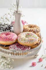 Yummy and fresh donuts with different sprinkles