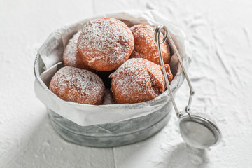 Sweet and fresh donuts balls with powdered sugar