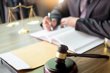 gavel and soundblock of justice law and lawyer working on wooden desk background.