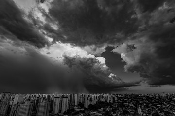 Beautiful view of the dramatic dark stormy sky in black and white. The rain is coming soon. Pattern of the clouds over city. Very heavy rain sky in Sao Paulo city, Brazil South America. 