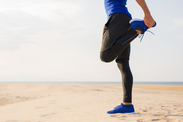 Woman stretching legs before workout