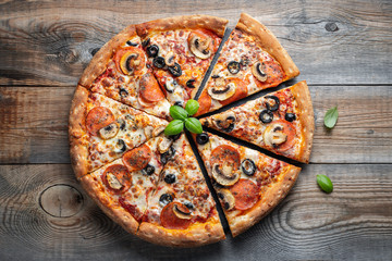 Tasty pepperoni pizza with mushrooms and olives.