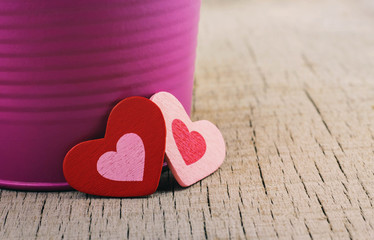 Fototapeta premium hearts and vases on wood.