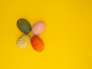 Fototapeta na wymiar Colorful Easter Eggs On Yellow Background
