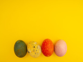 Colorful Easter Eggs On Yellow Background