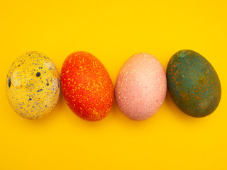 Colorful Easter Eggs On Yellow Background