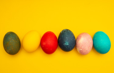Fototapeta na wymiar Colorful Easter Eggs On Yellow Background
