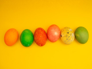 Colorful Easter Eggs On Yellow Background