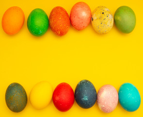Colorful Easter Eggs On Yellow Background