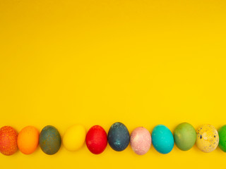 Obraz premium Colorful Easter Eggs On Yellow Background