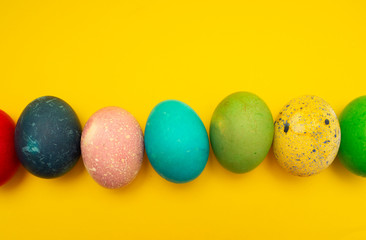 Colorful Easter Eggs On Yellow Background