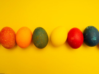 Colorful Easter Eggs On Yellow Background