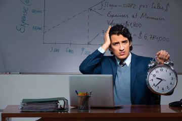 Financial specialist working late in the office