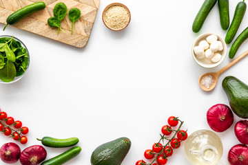 Fresh organic vegetables on white background top view space for text. Kitchen desk for preparing...
