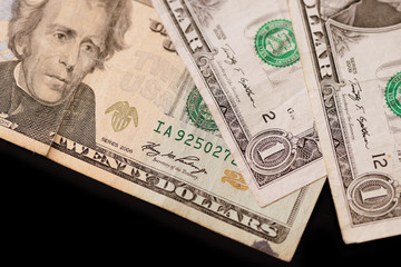 American dollars on a dark background. Brown color toned