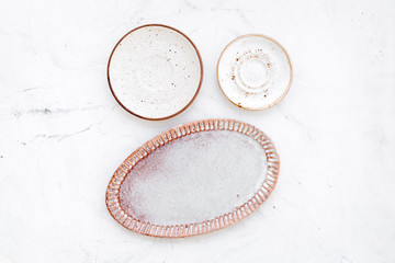 Kitchen concept. Crockery kit. Empty ceramic plates on white background top view copy space