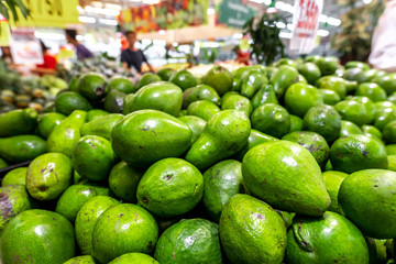 Fresh organic exotic green avocado on a local food market, Bali island. Avocado background.