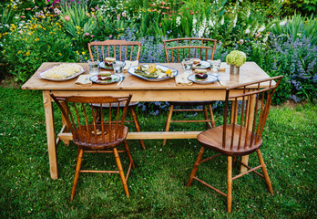 Summer New England dinner in flower garden