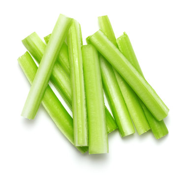 fresh green celery sticks isolated on white background