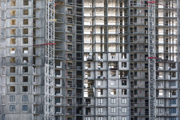 Fototapeta na wymiar Under construction apartment building and residential real estate, close up view