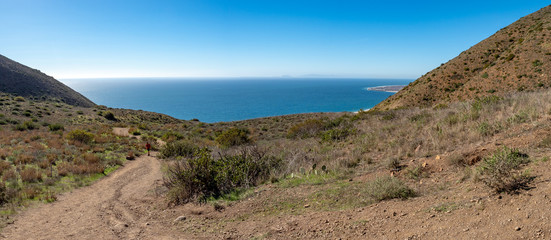 Boy walking at trailhead, Chumash and Mugu Peak trail, Point Mugu State Park, Ventura County, California, USA