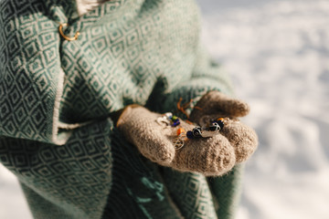 Vintage jewelry in women's hands in gloves
