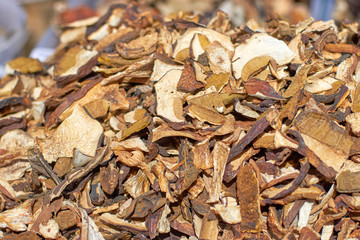 Sliced dried mushrooms on the counter on a sunny day, close-up texture and background