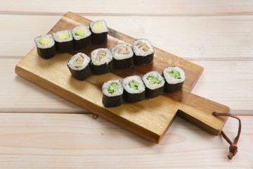 Set of rolls on wooden plate