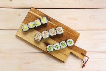 Set of rolls on wooden plate