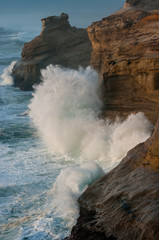 Waves crash at Cape Kiwanda, Oregon.