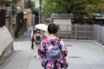 Rear view of unrecognized Japanese girl in a kimono at KIYOMIZU-DERA TEMPLE, Kyoto, Japan