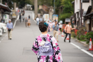 Rear view of unrecognized Japanese girl in a kimono at KIYOMIZU-DERA TEMPLE, Kyoto, Japan