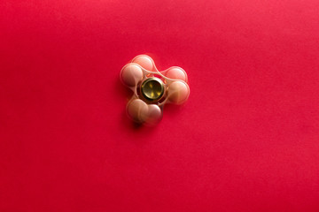 Stroboscopic photo of moving spinner on color background