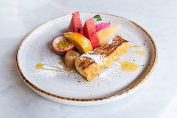 Close up of yummy french toast with fresh fruits.