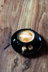 Obraz na płótnie Canvas cup of cappuccino with brown sugar