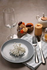 Beautiful table setting on grey background