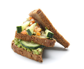 Tasty sandwich with avocado and vegetables on white background