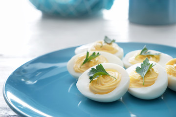 Tasty deviled eggs on plate, closeup