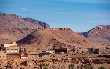 River area at M’Goun Valley – the Valley of the roses, where blossoms are harvested to make Rose Oil and other cosmetic products. Todra gorge and high atlas mountain.  Berber houses