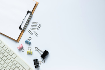 Top view keyboard,notebook,pen,paperclip or object for office on white background.