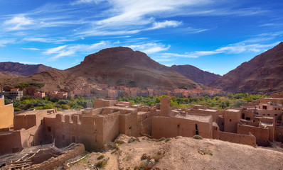 River area at M&rsquo;Goun Valley &ndash; the Valley of the roses, where blossoms are harvested to make Rose Oil and other cosmetic products. Todra gorge and high atlas mountain.  Berber houses