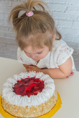 kids eating cake on white brick wall background