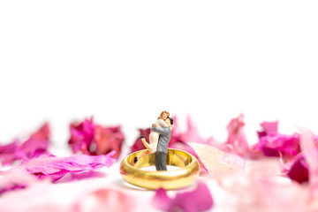 Couple hug in The pink garden with a wedding ring