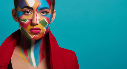 Trendy colorful make up on model face.