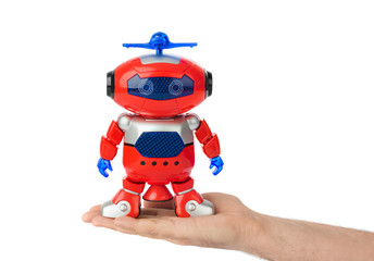Naklejka premium Hand with toy robot