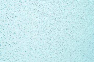 Beautiful texture of drops on the glass, tinted photo, background.